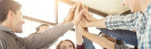 Colleagues giving each other a high five